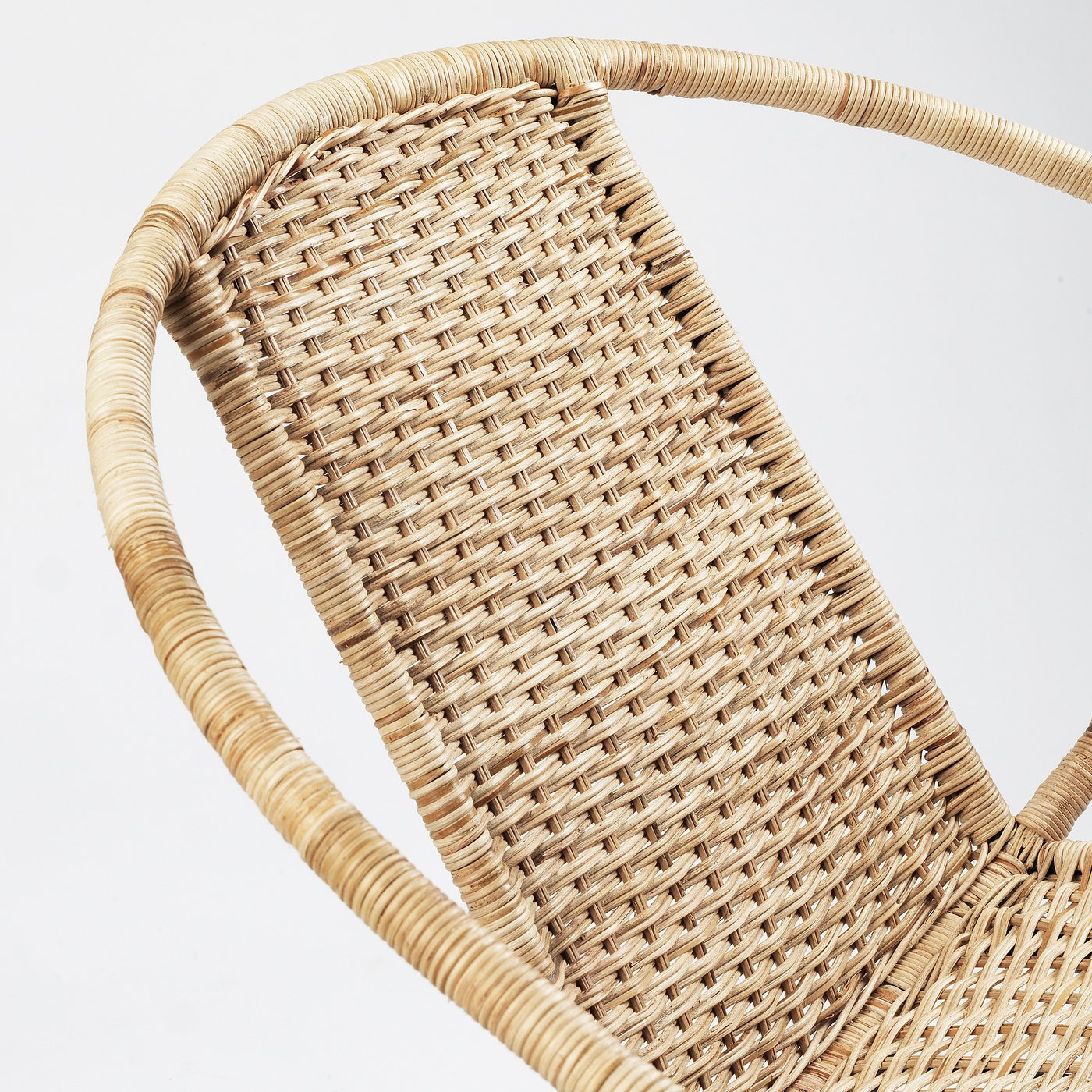 Woven rattan chair, finely detailed, sturdy build.