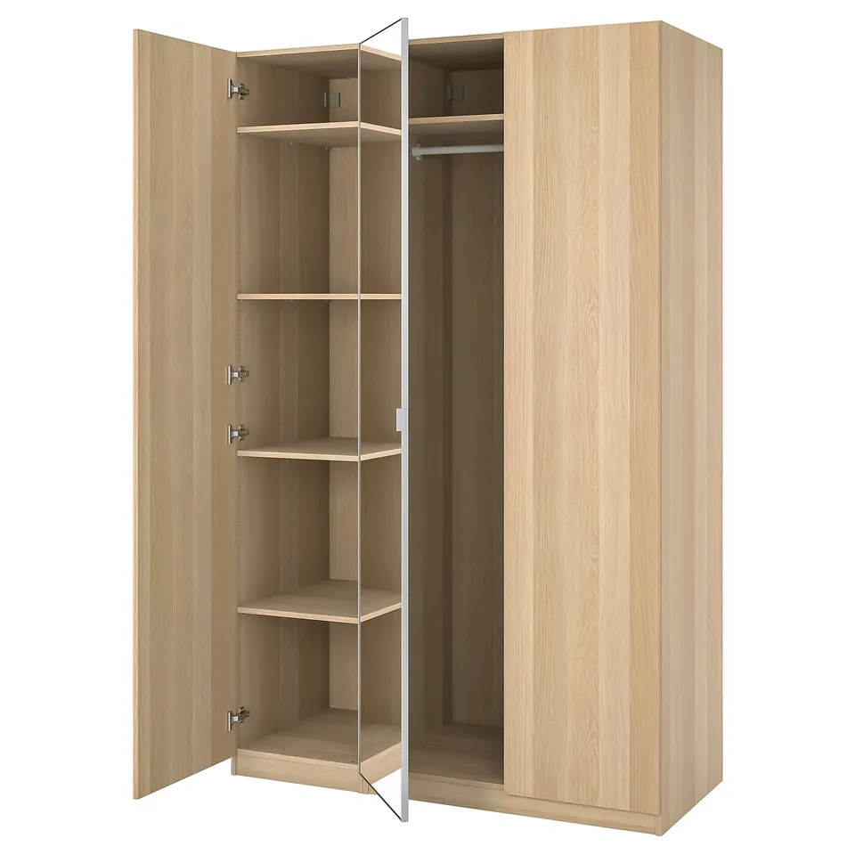 Light wood-colored PAX wardrobe with mirror door, open showcasing shelves and hanging rail.
