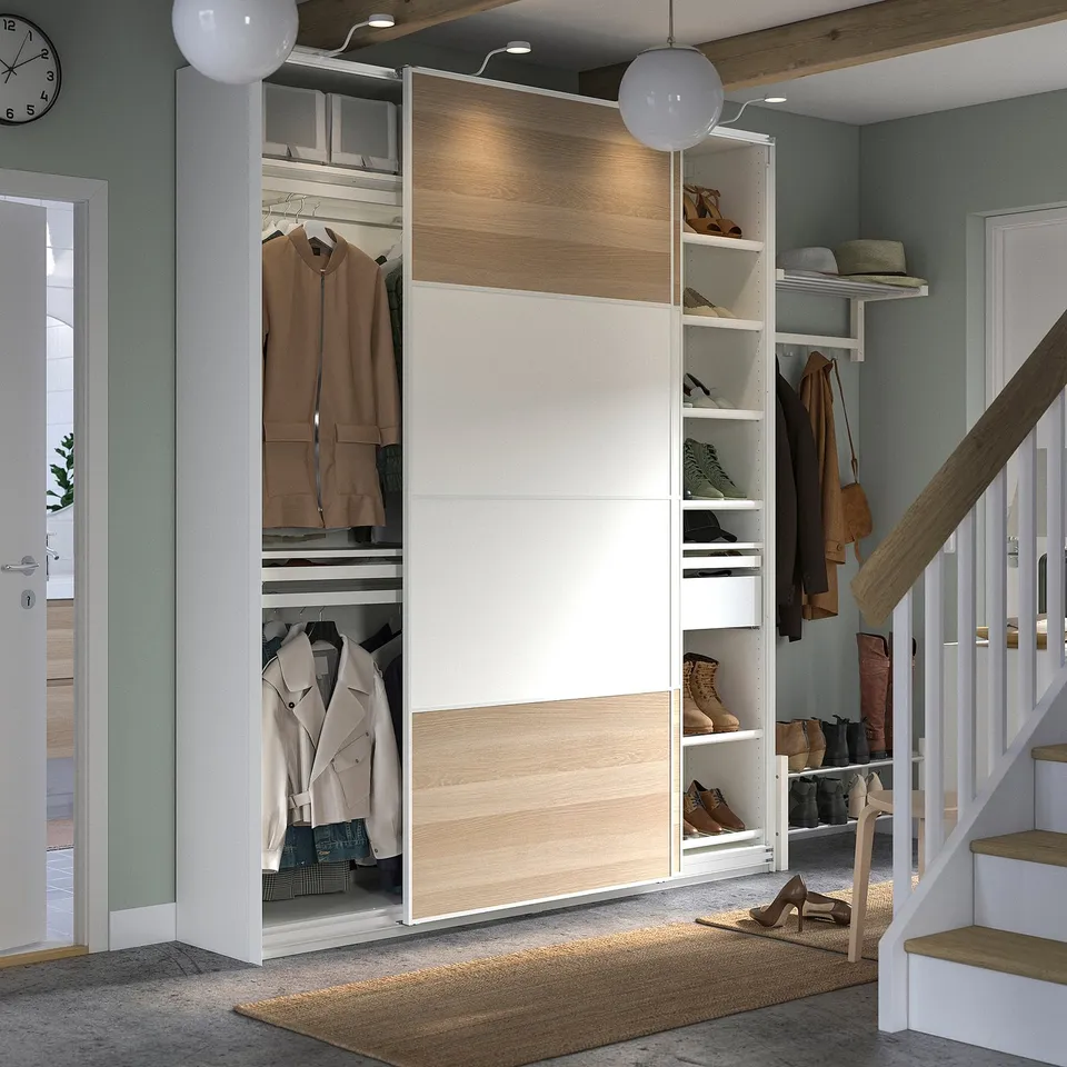 Modern hallway wardrobe, PAX, white and light wood, sliding doors, shoe shelves, clothes rail, integrated lighting.