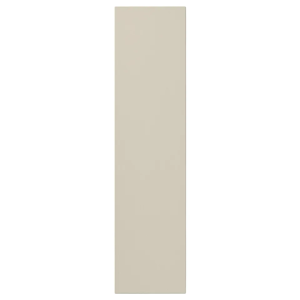 A beige HAVSTORP kitchen cabinet door in a rectangular shape. Its smooth with clean lines, offering a modern and neutral design.