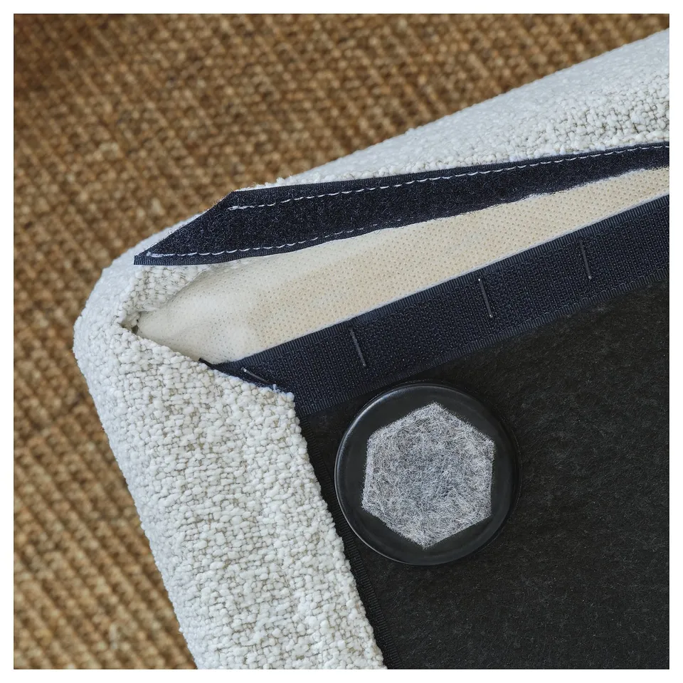 Close-up of STOCKHOLM 2025 chair corner, showing stitching, fabric, and plastic clip.