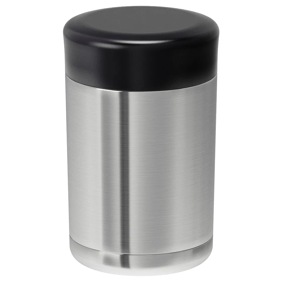 An EFTERFRÅGAD thermos in silver with a black lid. Made of stainless steel and plastic, its cylindrical with a wide mouth for easy use.