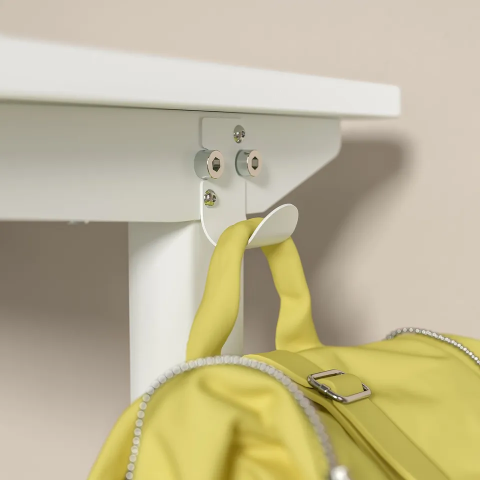 A white, height-adjustable desk for kids in lemon yellow. A crank handle for height adjustment and cable management at the base.