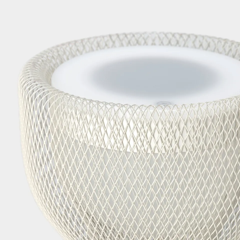 White wire mesh lamp with minimalist style; close-up showing intricate design and clean finish.