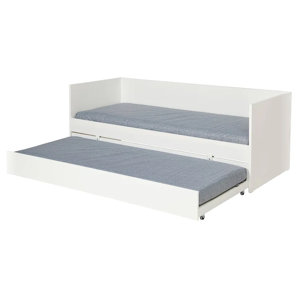 A white VIHALS day-bed with a trundle. It a clean design and grey mattresses. Perfect for small spaces, it converts into a sofa with pillows.