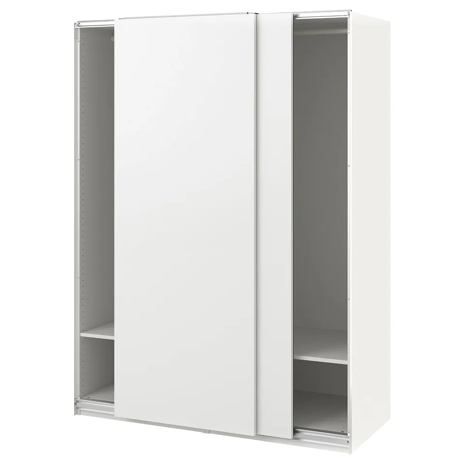 A white ikea PAX wardrobe with sliding doors and adjustable shelves. Minimalist and modern design.
