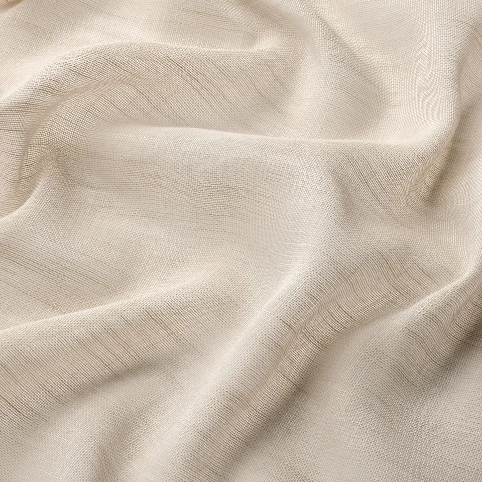 Sheer beige curtains, smooth texture, light filtering, quality fabric.