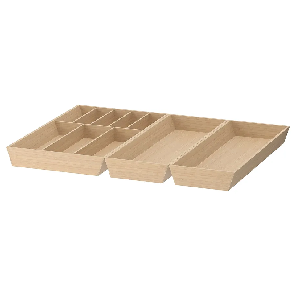 Three UPPDATERA bamboo cutlery trays. Light brown, rectangular, with multiple compartments. Ideal for organising kitchen drawers.
