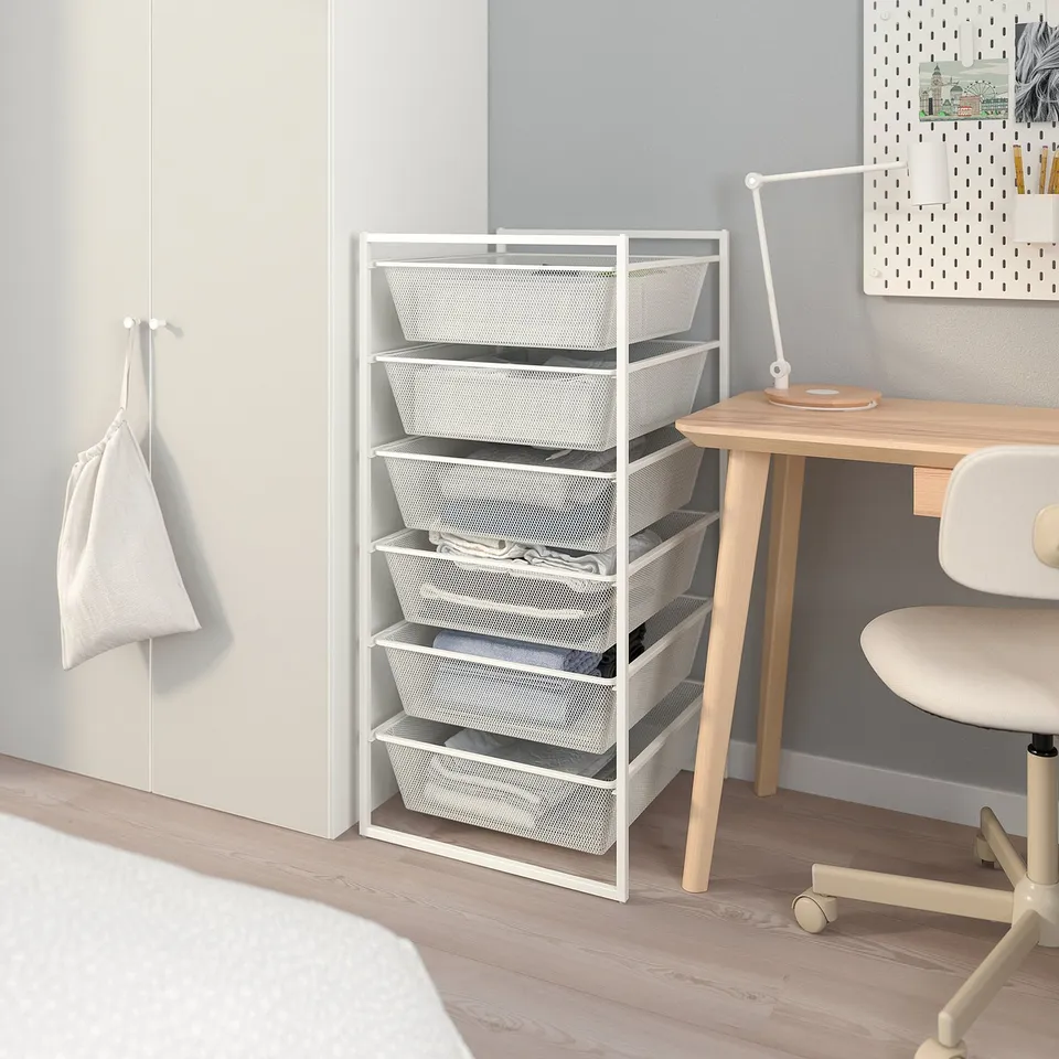 JONAXEL mesh storage unit in white. Tall, slim design; fits neatly by desk and chair. Five drawers in wood floor room.
