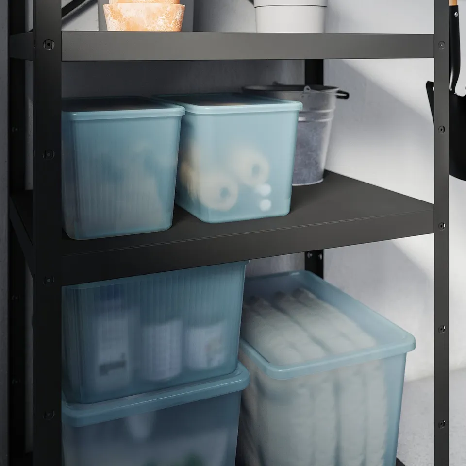 Shelf with blue plastic storage boxes, each with lid, for organising items.