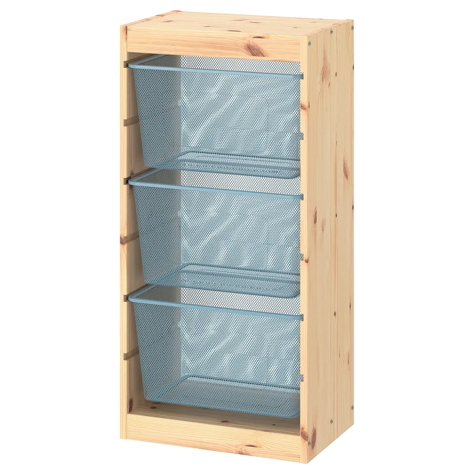A TROFAST storage unit with three blue mesh cubes in a light pine frame. Designed for organising items.