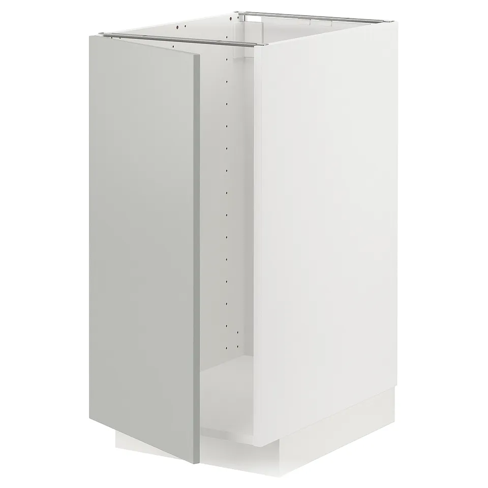 White METOD cabinet. Modern, rectangular design with light grey finish. Made from fibreboard, particleboard, and steel.