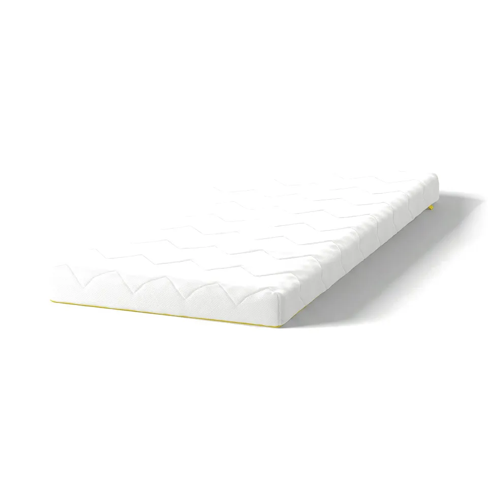 White junior mattress, egg-patterned, rectangular, rolled, yellow zip by IKEA.