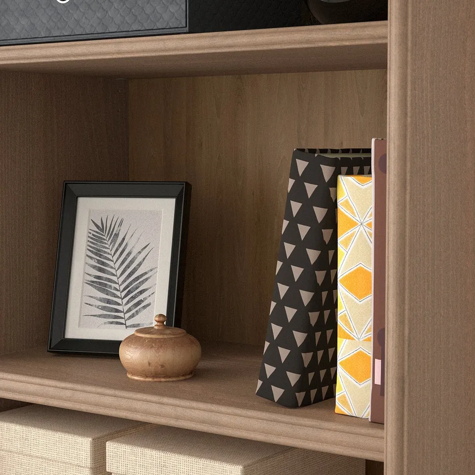 Wooden bookshelf with adjustable shelves. Open storage for displaying books and decor.