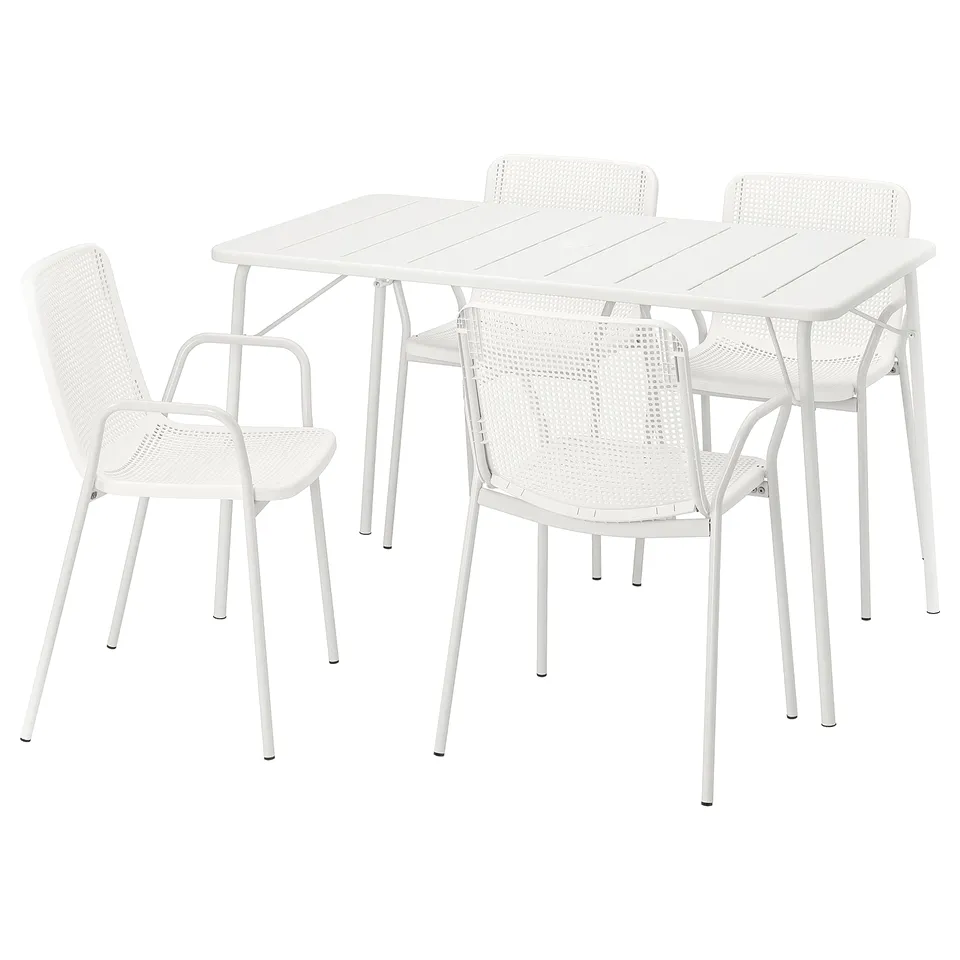 White patio set with rectangular table, 4 modern chairs, drainage holes.