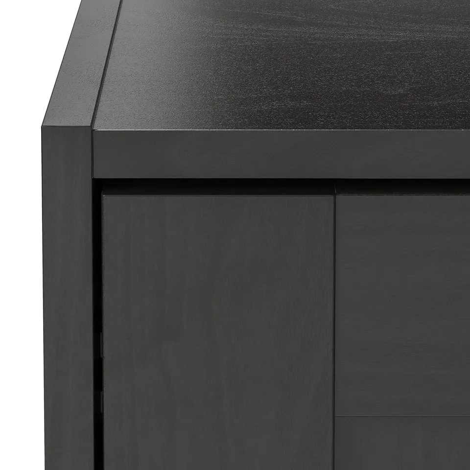 Black wooden furniture close-up, smooth finish, clean edges.