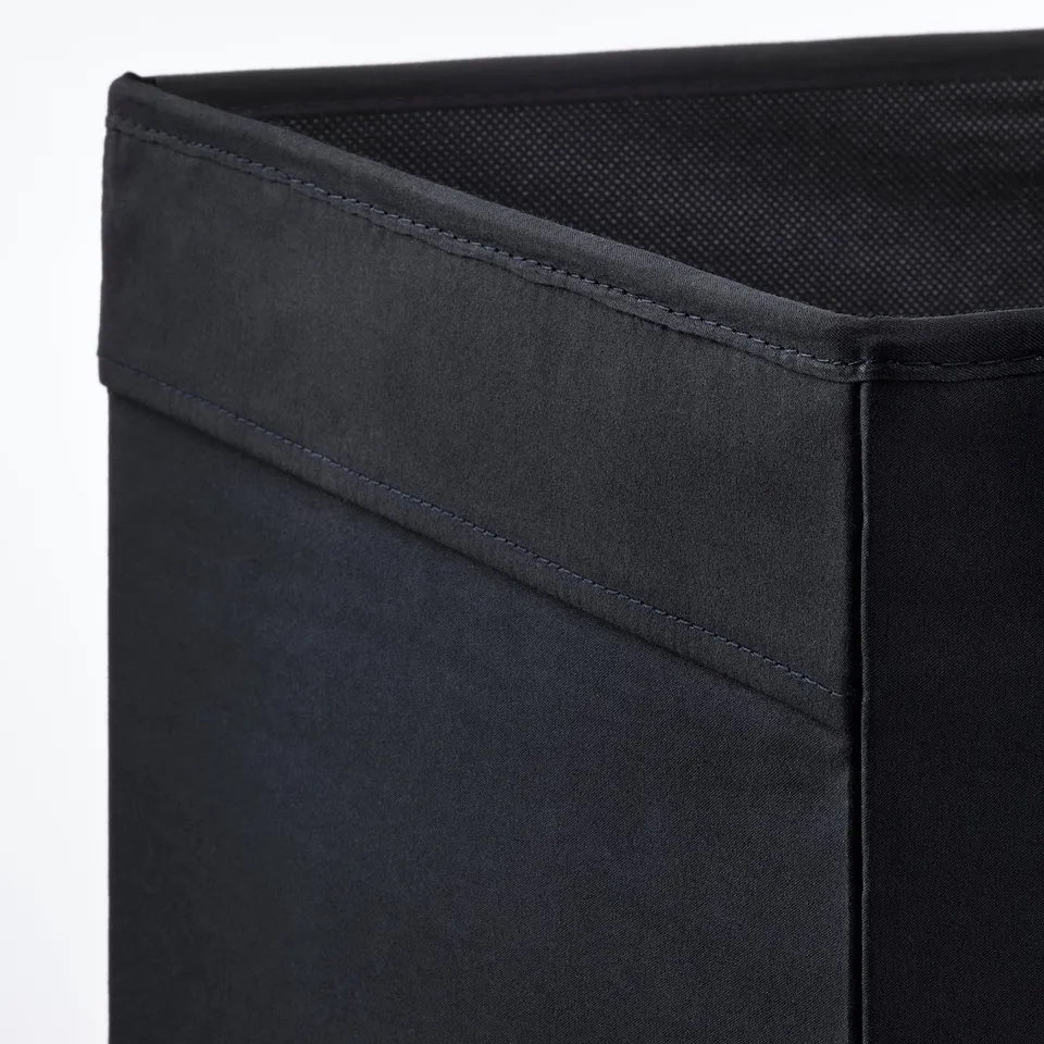 Black storage box with sturdy stitching and mesh top, showcasing quality construction.