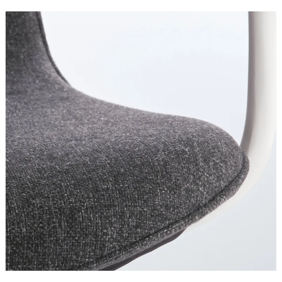 Close-up of LÅNGFJÄLL office chairs cushioned seat and armrest, showcasing high-quality fabric and sturdy design.