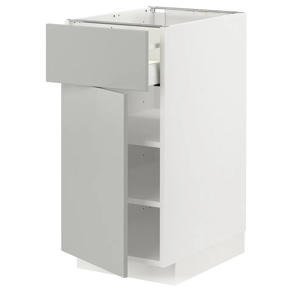 White METOD kitchen cabinet with light grey havstorp drawer, modern design.