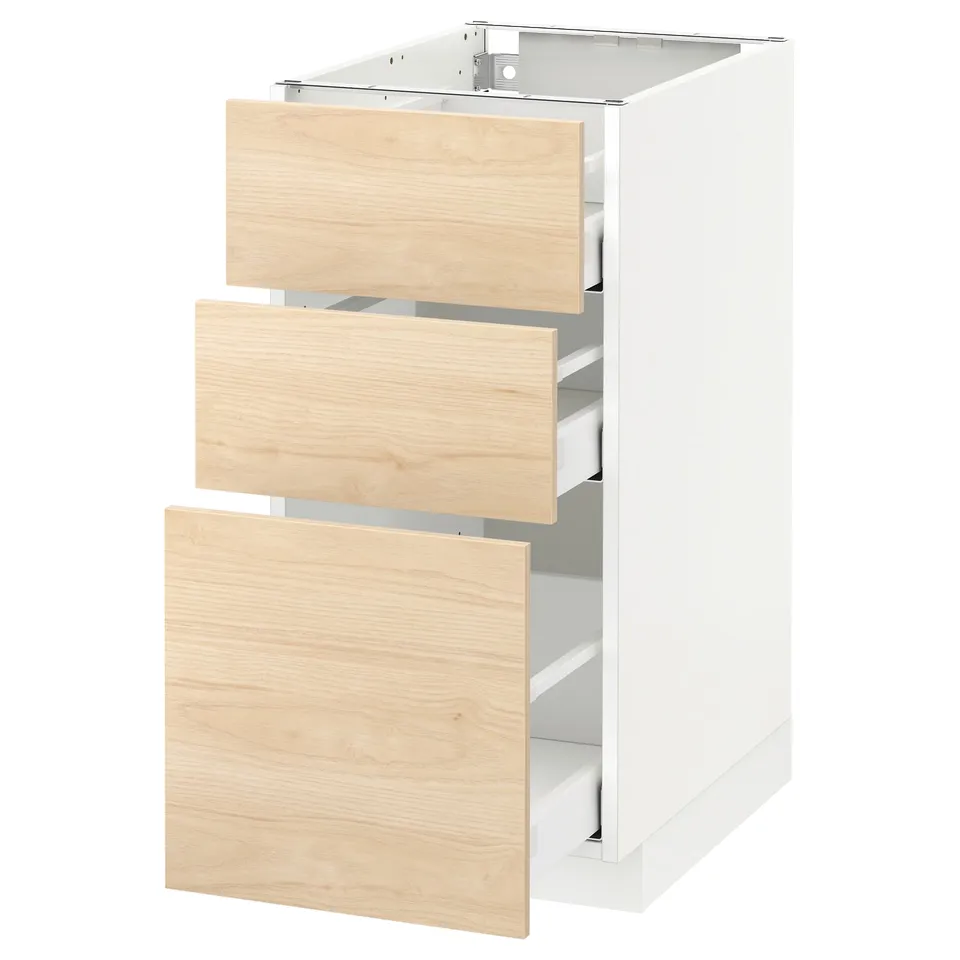 A white and light wood kitchen cabinet set with three drawers partially open, showcasing a modern minimalist design.