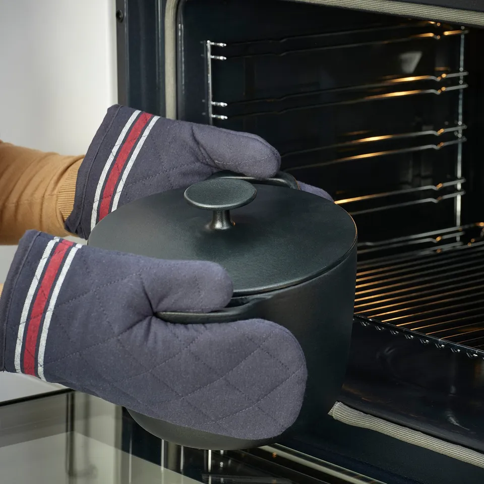Cooking with cast iron, oven mitts.