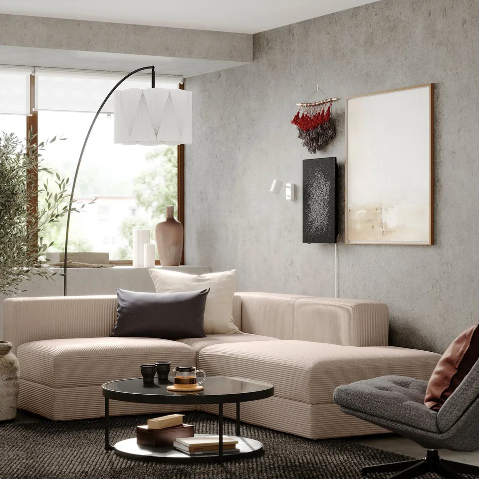Modern living room with beige JÄTTEBO modular sofa, grey cushions, coffee table, and abstract artwork.