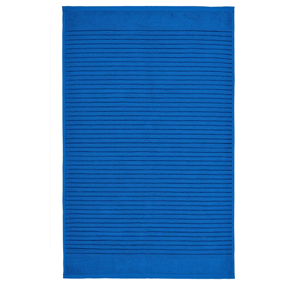 Bright blue rectangular ALSTERN bath mat, made from pure cotton terry, highly absorbent, fast-drying.