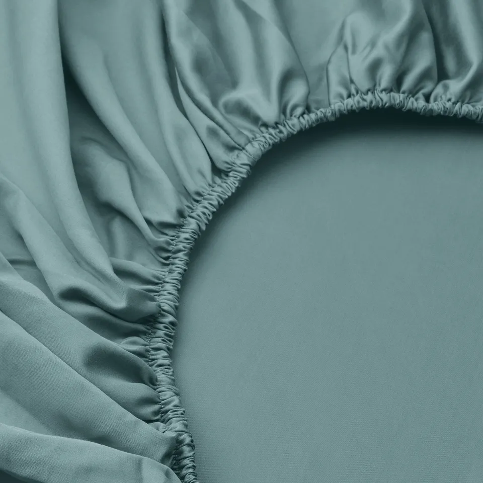 Luxurious blue-green sheet with elastic edges.