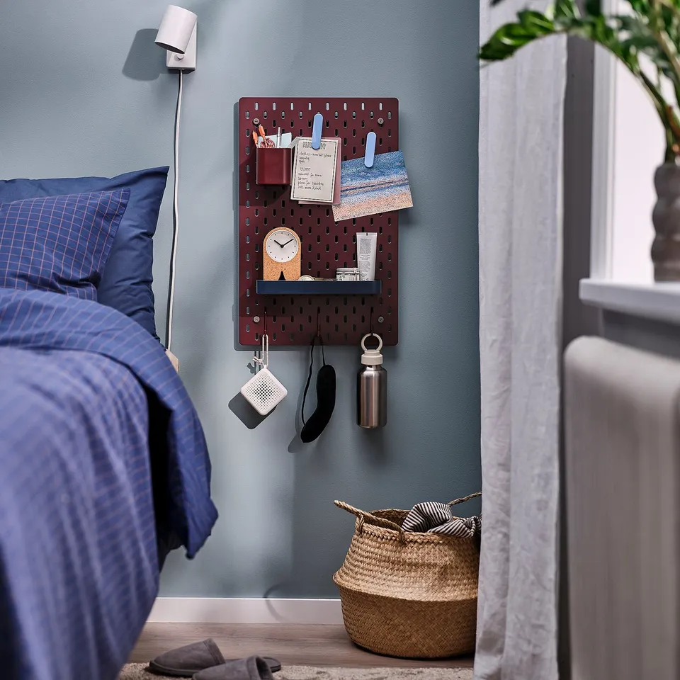 SKÅDIS pegboard, maroon, fiberboard, rectangular, practical. Near bed, larger than pillow, holds items.