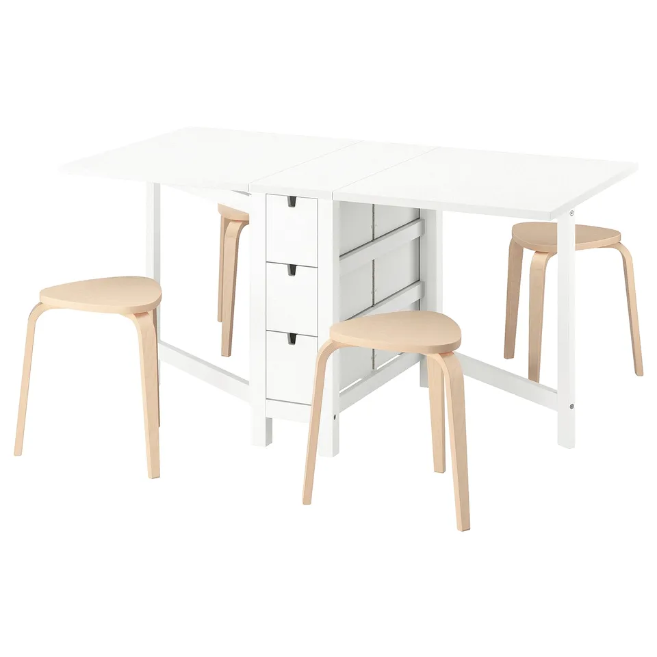 White NORDEN table set. Table has 6 drawers, accommodates 4. Light wooden stools. Minimalist, modern design.