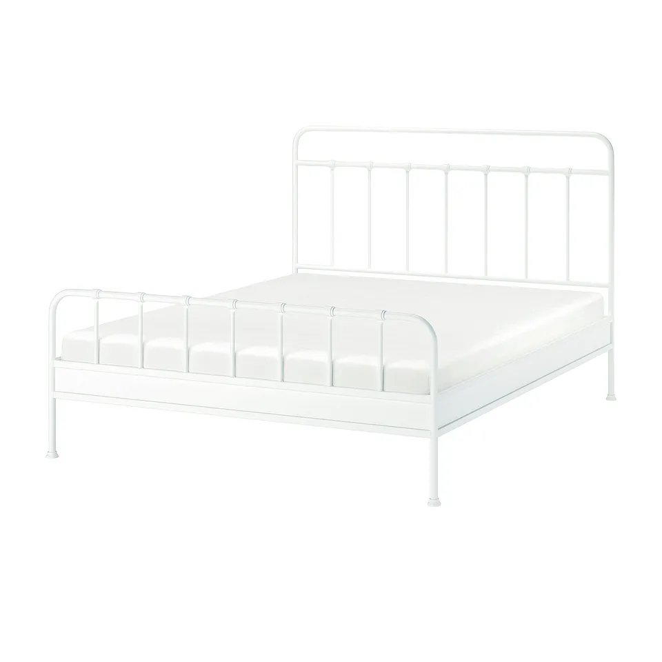 A white metal bed frame named STJÄRNÖ with a curved headboard and footboard, displaying a classic yet distinctive design.