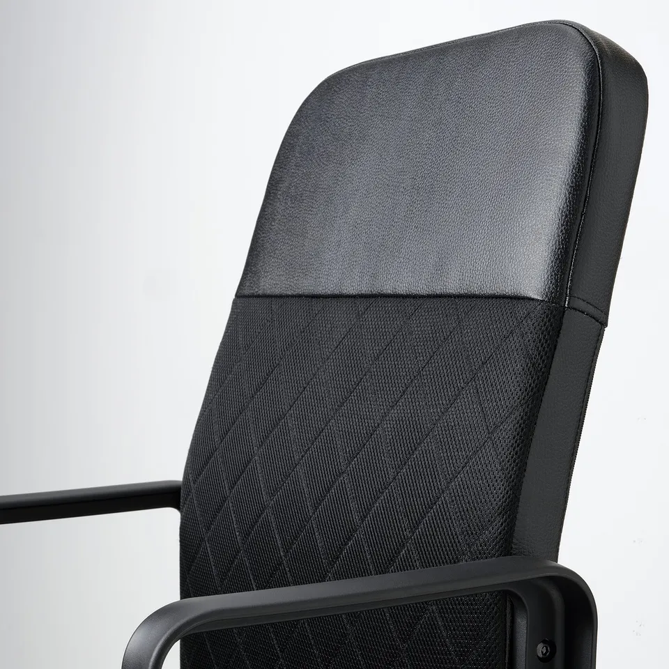 A sleek, modern office chair. A cushioned, adjustable seat and back. Armrests offer support, set against a white background.