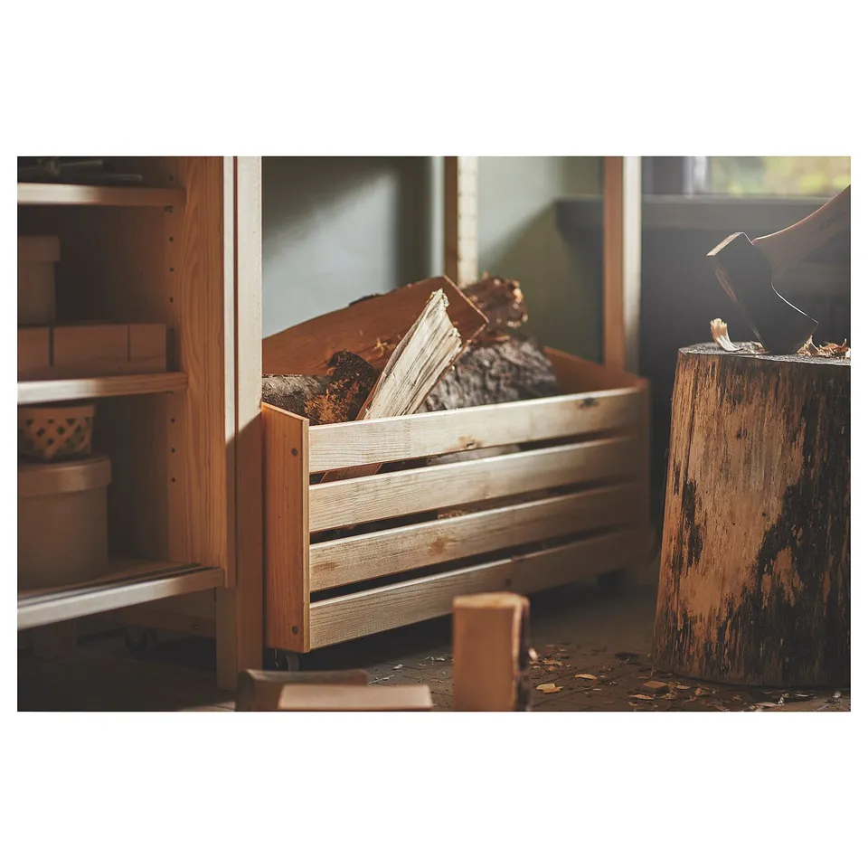 Wooden storage crate with logs, placed near a chopped log stand.