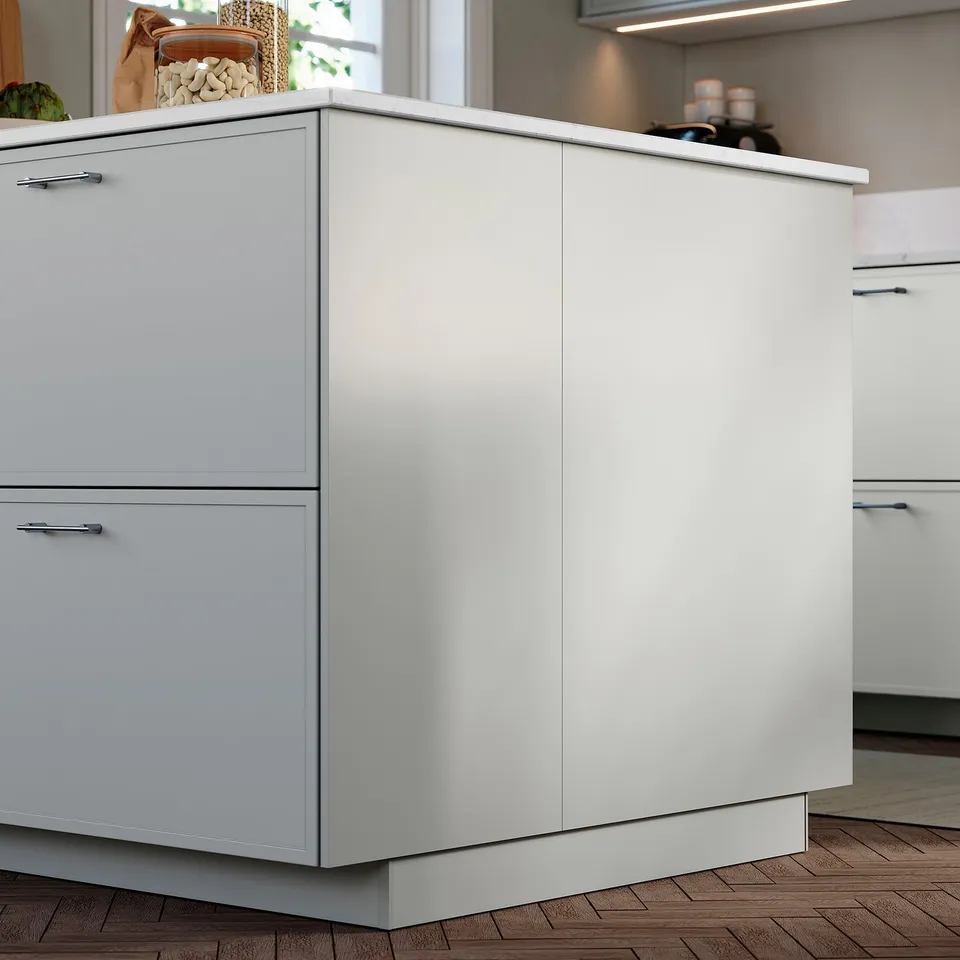 Grey ASPUDDEN cover panel for under kitchen cabinets, sleek & minimalist with plastic finish.