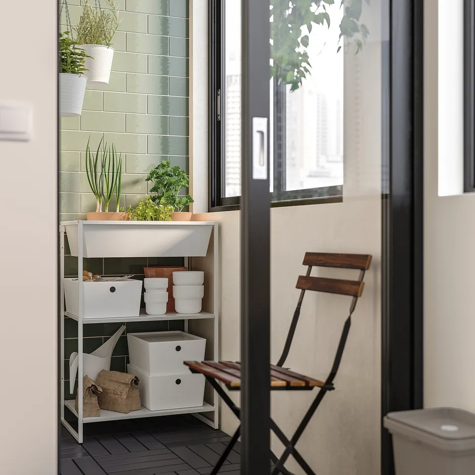 Modern indoor-outdoor storage unit with shelf, white, metal, rectangular, minimalist.