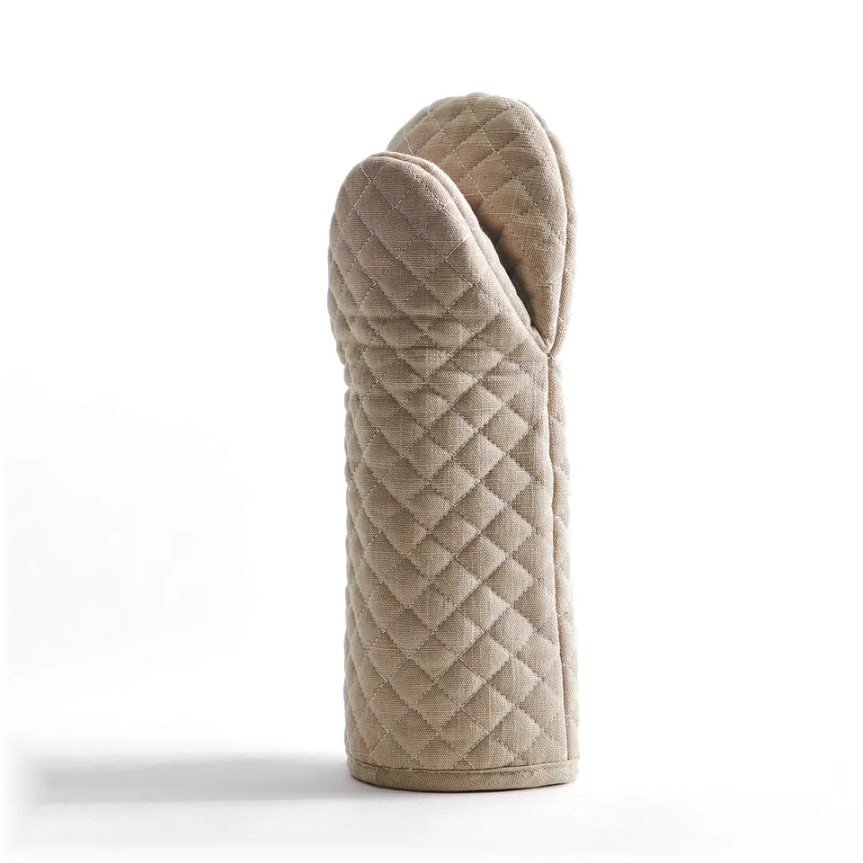 Beige oven glove with quilted design, loop for hanging, and heat-resistant felt layer. Offers safe and stylish kitchen protection.
