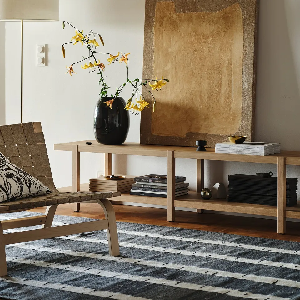 STOCKHOLM 2025 rug: grey birch tree design, handwoven wool with cotton backing.