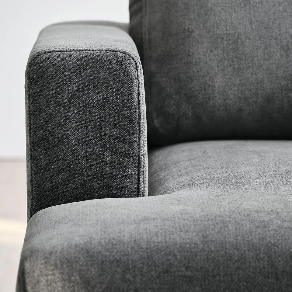Close-up of UPPÅKRA sofas plush, textured fabric, highlighting its soft texture and high-quality material.