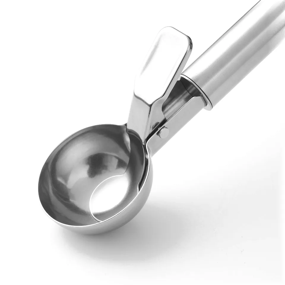 Silver ice cream scoop with long handle and lever, resting on a white surface.