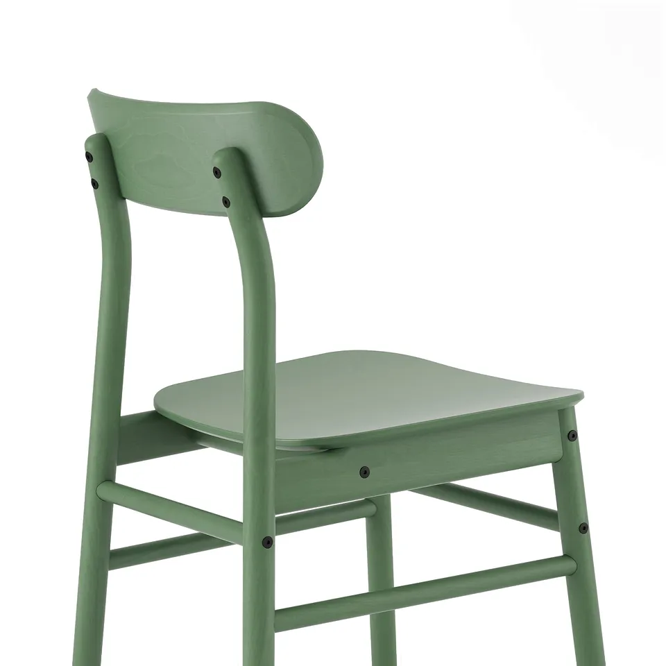A sleek, mint green wooden chair showcasing its robust and smooth design with rounded seat and backrest, emphasising quality and comfort.