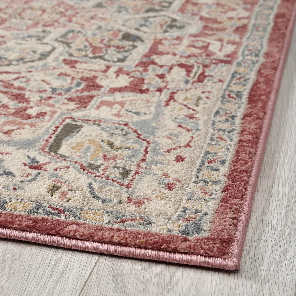 Elegant, colourful rug with intricate patterns, soft yet durable, ideal for busy spaces.