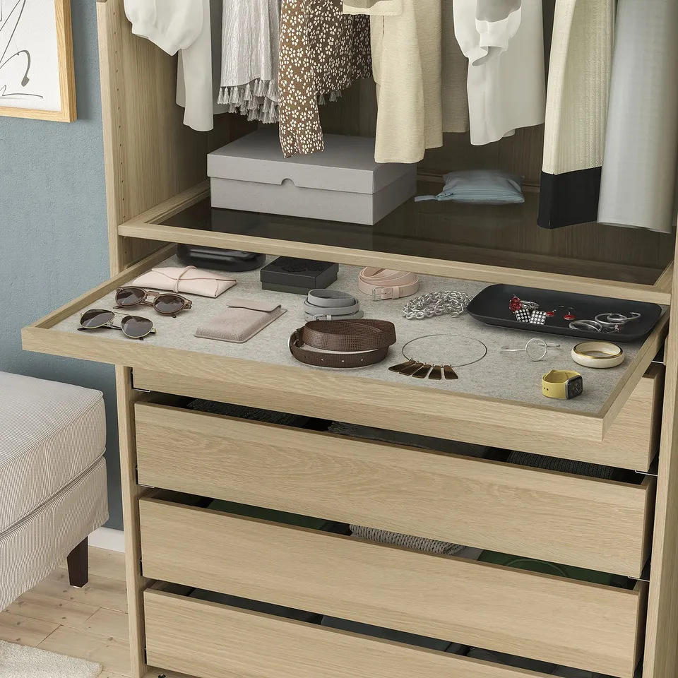 Wooden dresser with light finish, pull-out tray for accessories, soft-close.