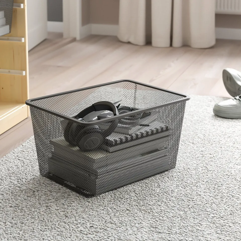 Mesh storage box on carpet, suitable for TROFAST frames, easy to pull out and carry.
