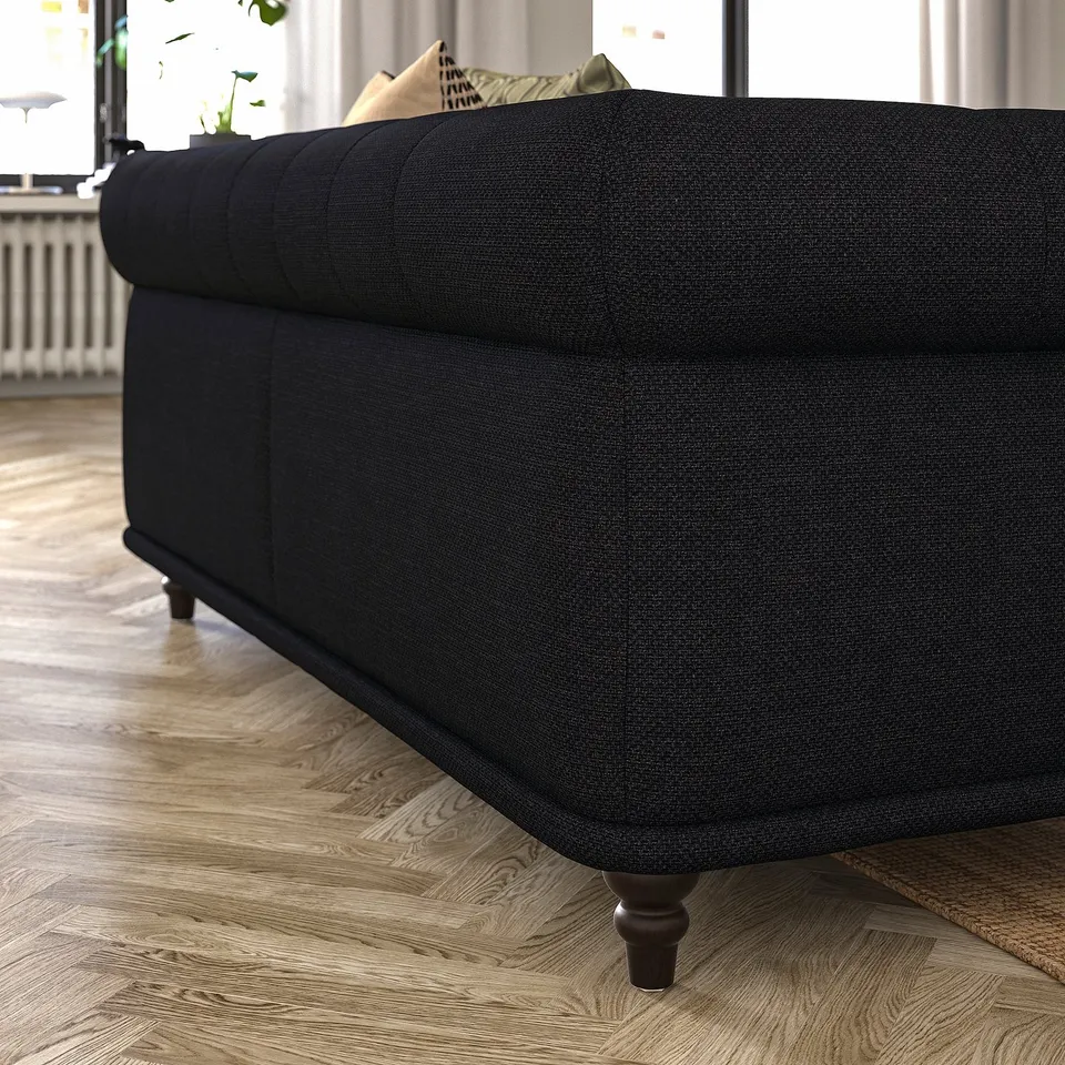 Black VISKAFORS sofa, classic design with round shapes, dark fabric, wooden legs, cosy deep seats.