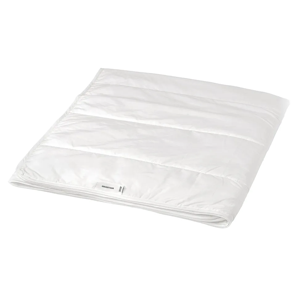 Displays a white grusstar duvet for bedding, featuring a printed dot fabric and a rectangular shape.