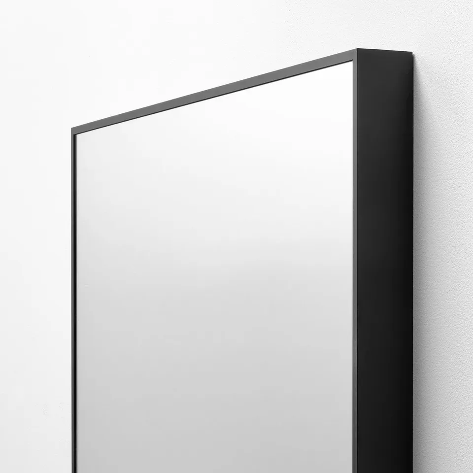 Large frameless mirror, anodized edge, clear glass.