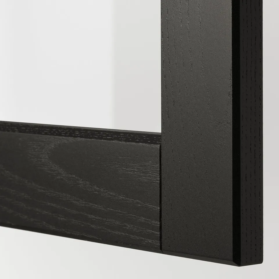 Close-up of black framed glass, showing sturdy, sleek design.