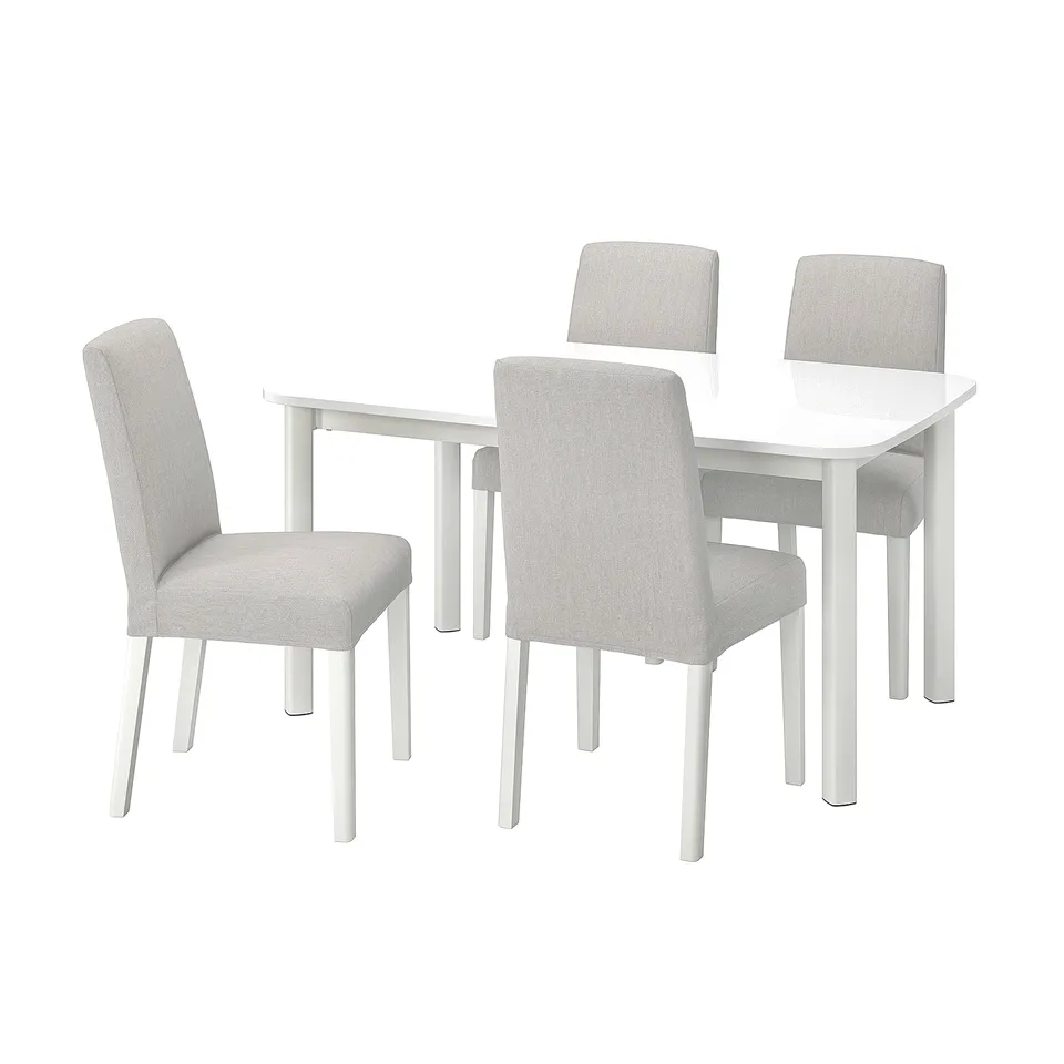 A white STRANDTORP dining set with four matching chairs.