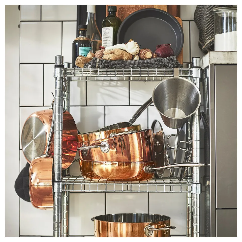Copper pots and pans on shelf, FINMAT series by ilse crawford.