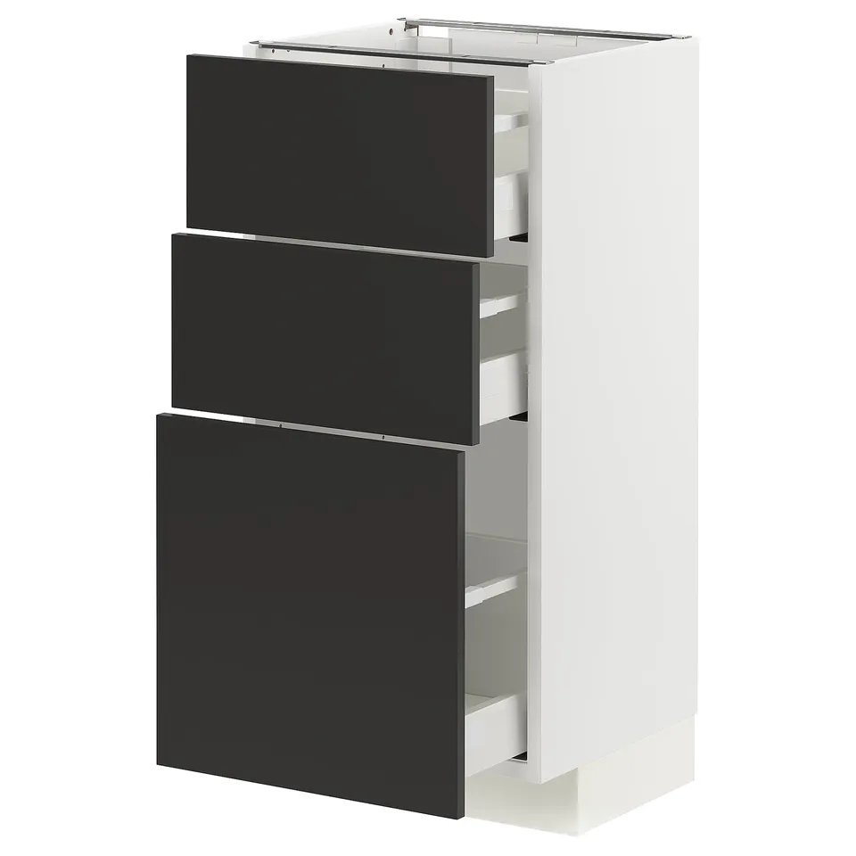 Modern kitchen unit with black drawers, white frame, sleek design.